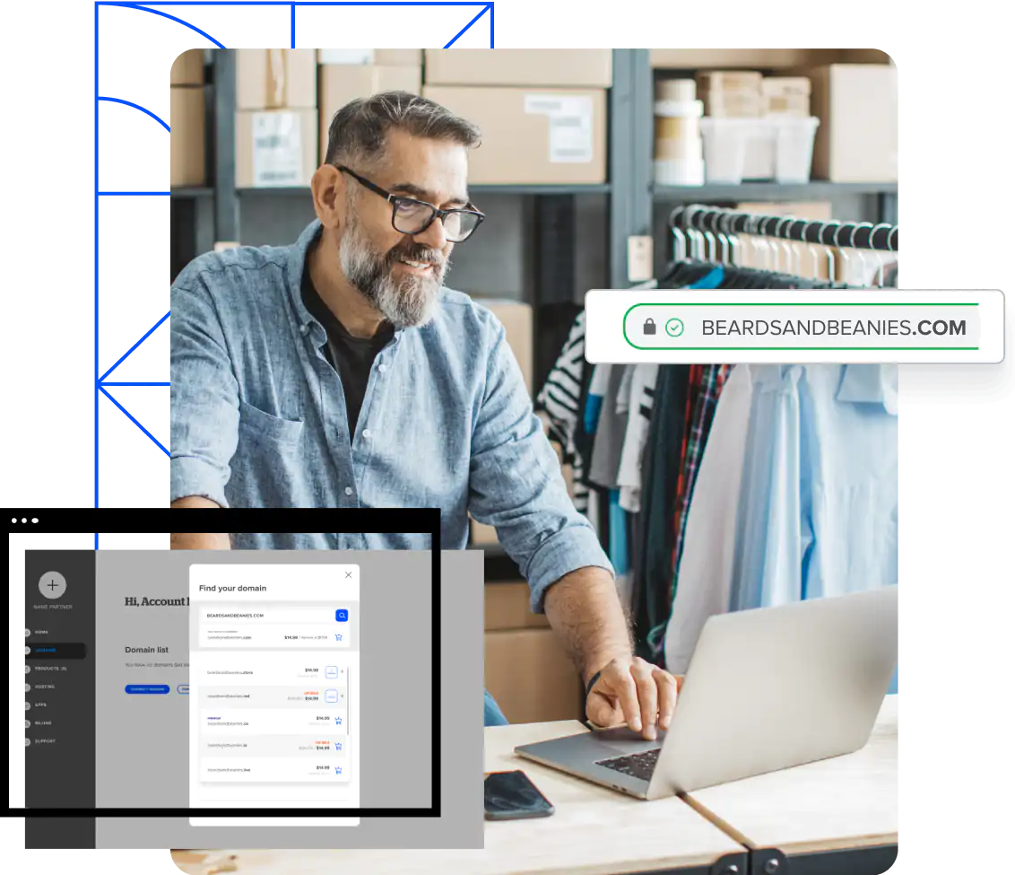 Man sitting at desk smiling at laptop